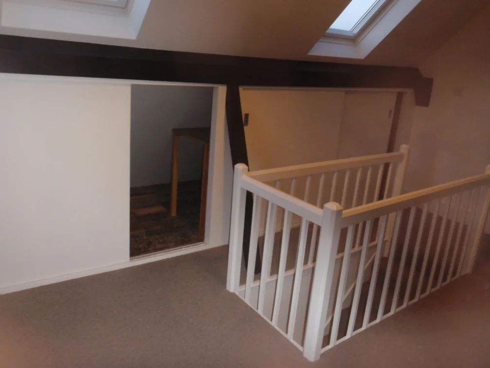 The attic landing with rooflights and sloping ceilings